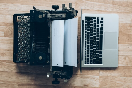 A typewriter and a laptop